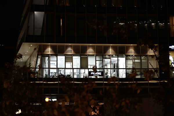 Modern commercial office building with professional lighting at night