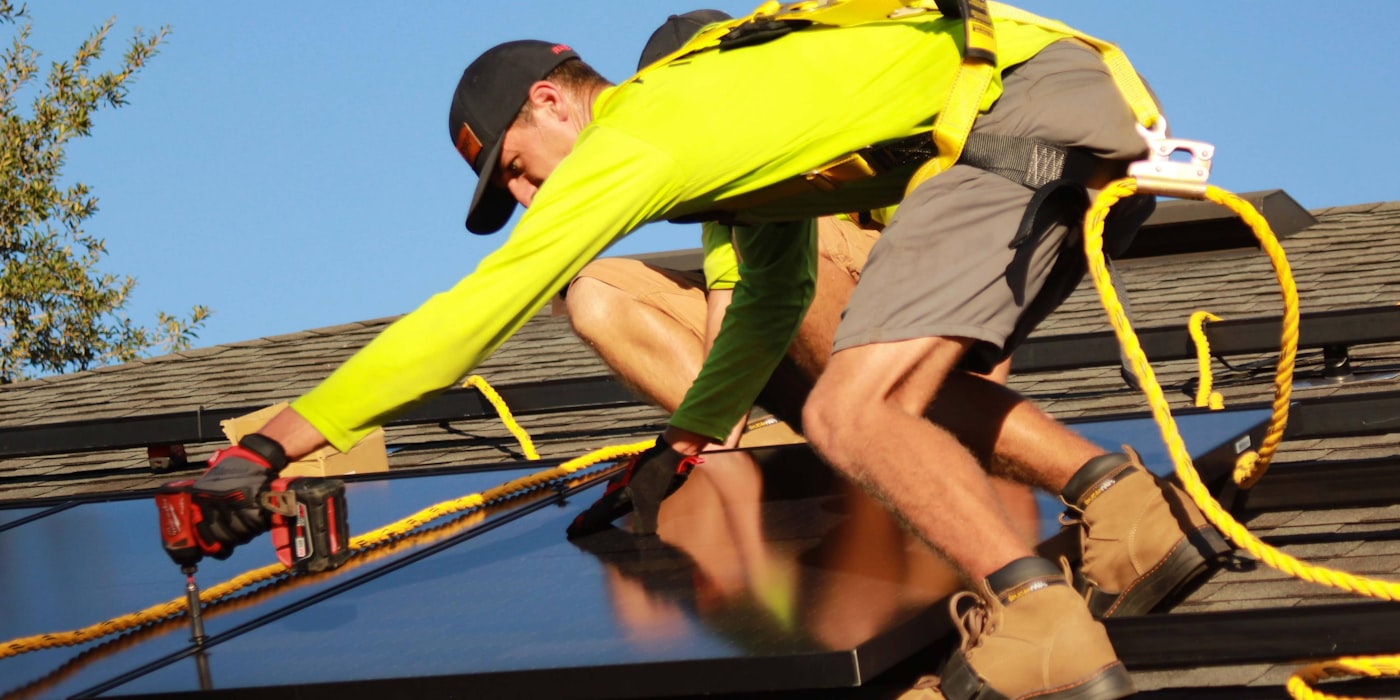 Technicians performing maintenance and repairs on residential property