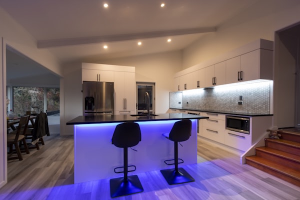 Modern kitchen illuminated with LED recessed and accent lighting